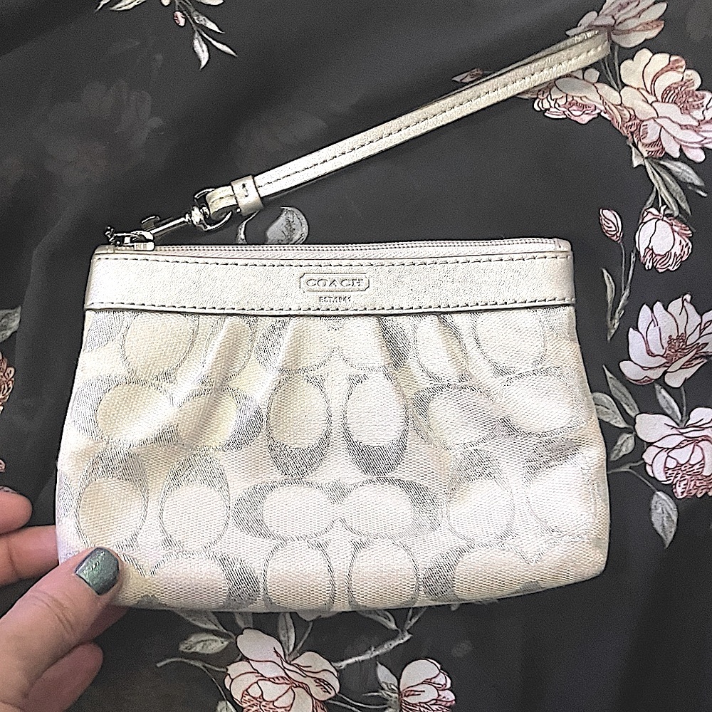 Gorgeous silver Coach wristlet good used condition